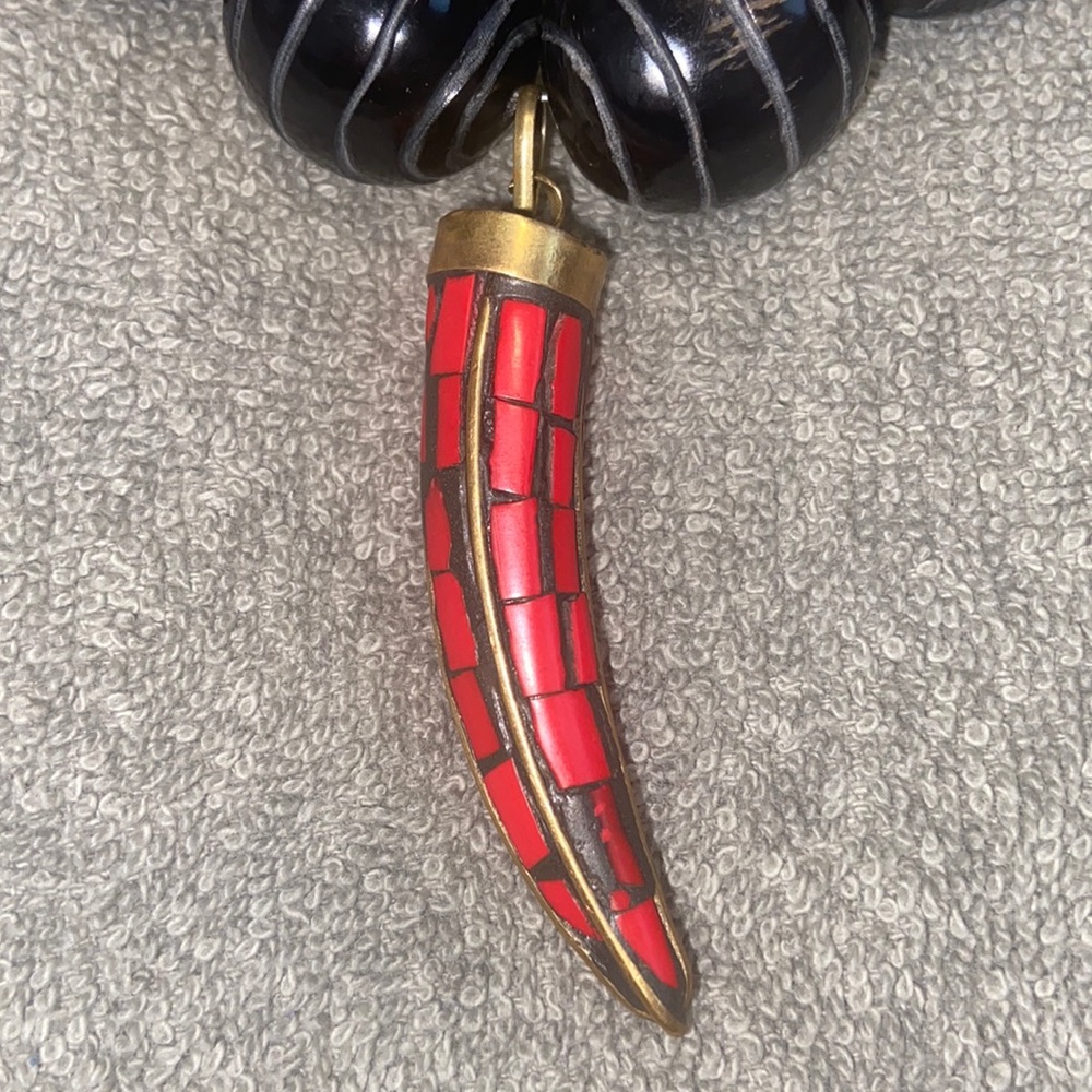 African strength necklace.